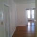 Living room and master bedroom varnished hardwood floors. From living room access to 3 bedrooms. 